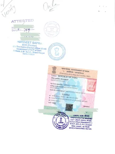 Sample e-Apostille (QR) affixed to an Indian birth certificate, with the SDM attestation stamp above it and the QR code and verification ID printed on the stamp
